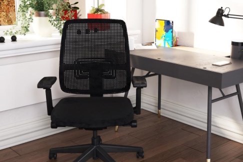 Black mesh office chair at a desk.