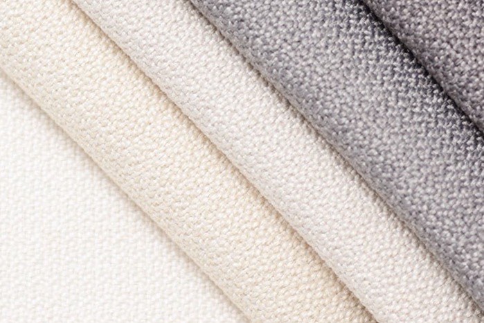 Cream and grey swatch folds showing a tight knit texture.